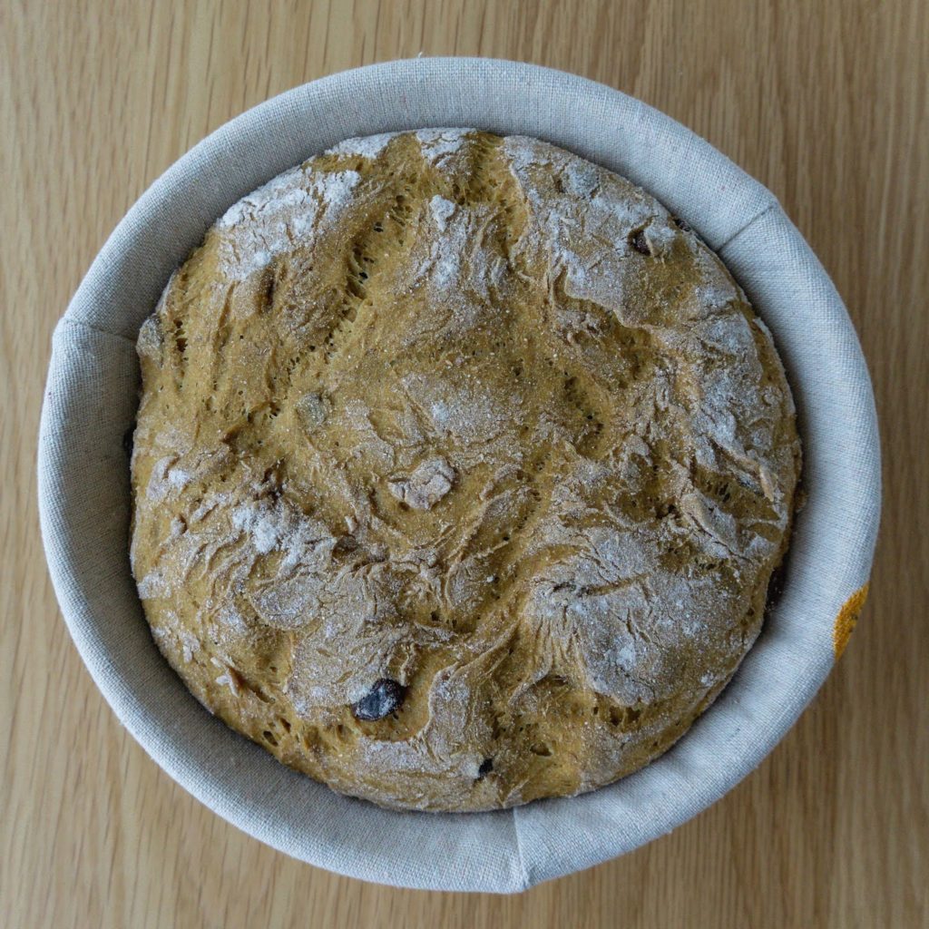 The curried bread loaf during the final prove.
