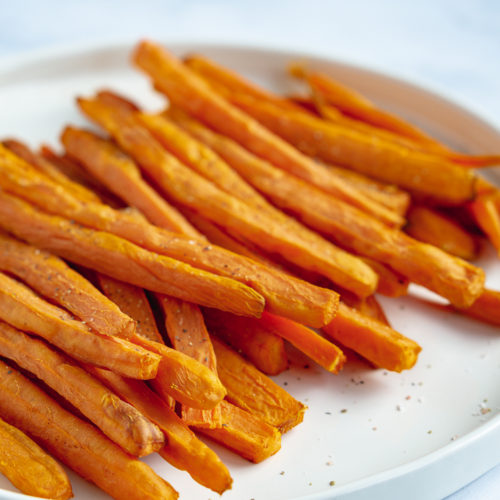 Oil free sweet potato fries on a white plate