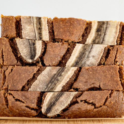 Easy banana bread slices on a bamboo wood cutting board