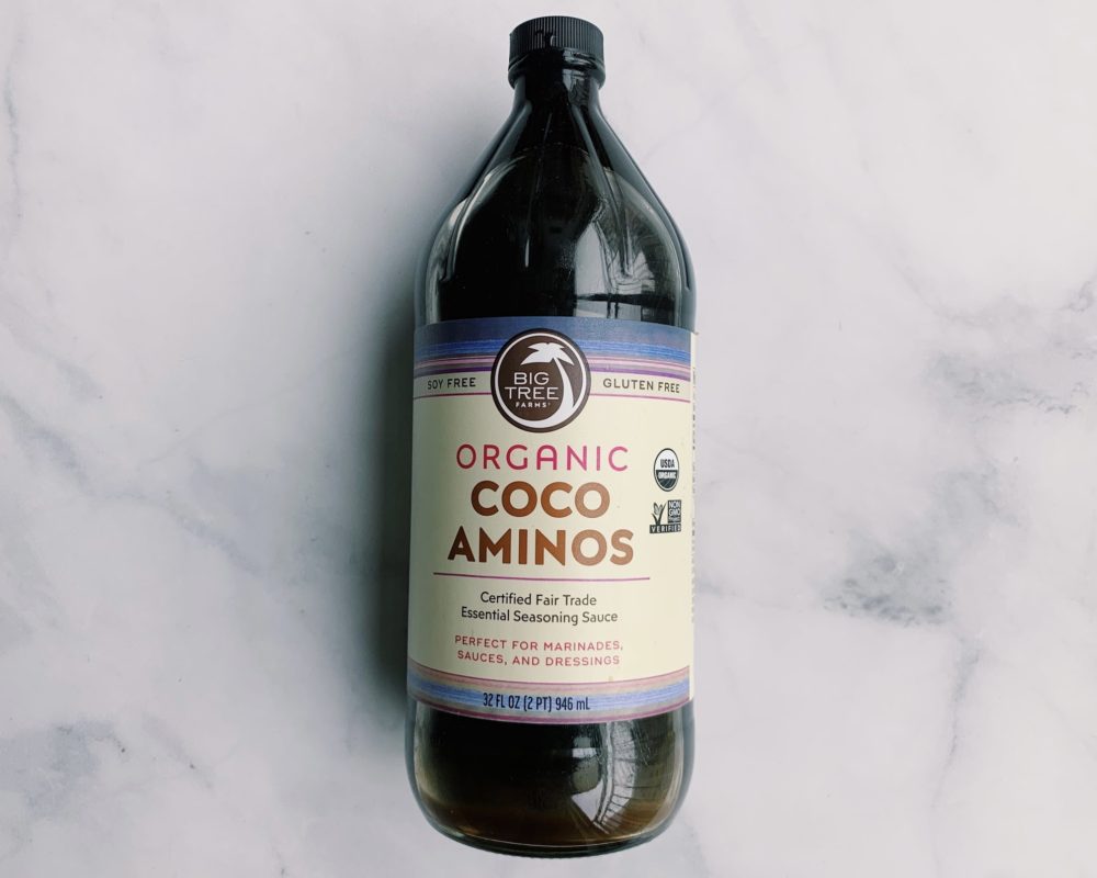 Coco Aminos bottle on a counter